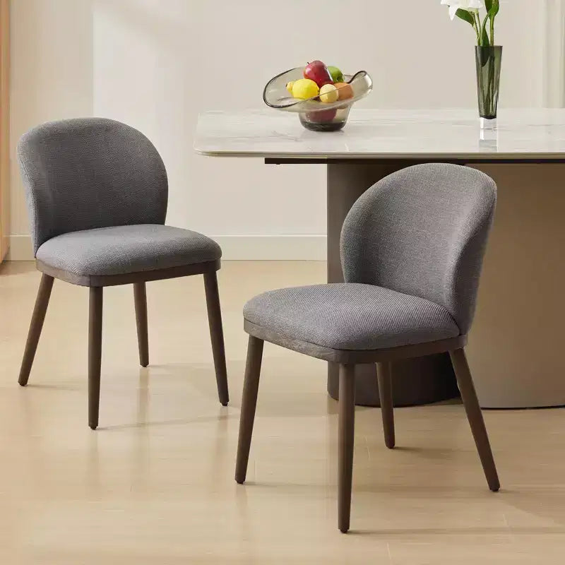 Two-piece dining chair set, upholstered seats, wooden legs, ergonomic design, 265 lbs weight capacity, suitable for dining rooms.